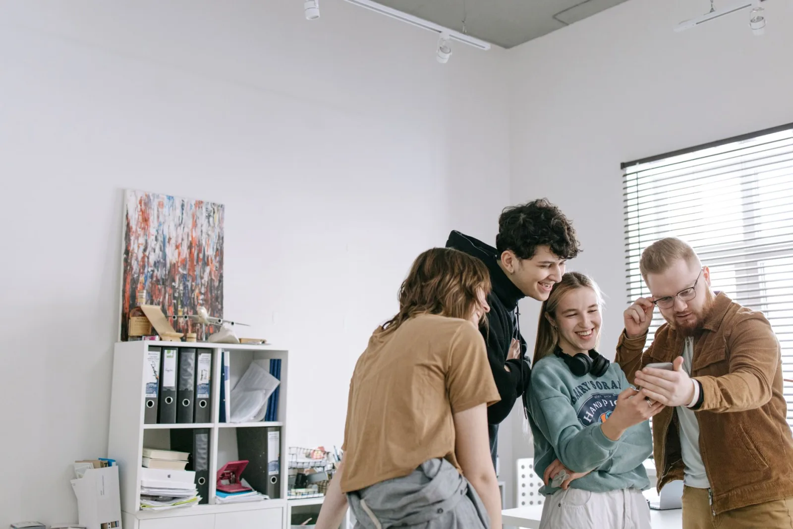 A team smiling in an office, the people behind free accessible tools