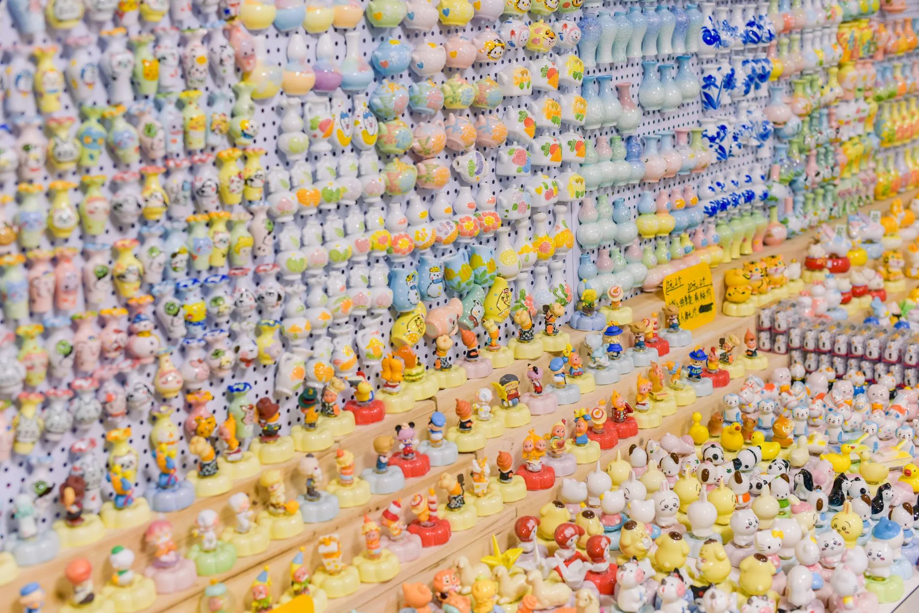 Colorful collectible figurines displayed together on a shelf