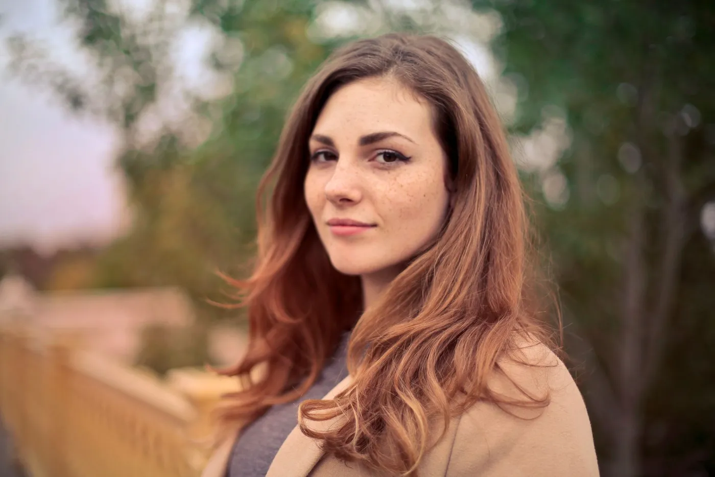 Outdoor portrait with shallow depth of field, useful for testing mobile crops after AI face enhancement
