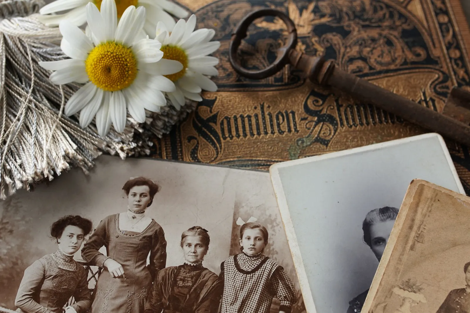 Vintage family photographs arranged on a surface, ideal for AI restoration