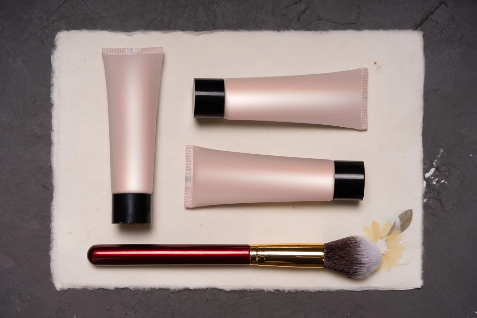 Cosmetic tubes arranged as a product still life for an online store