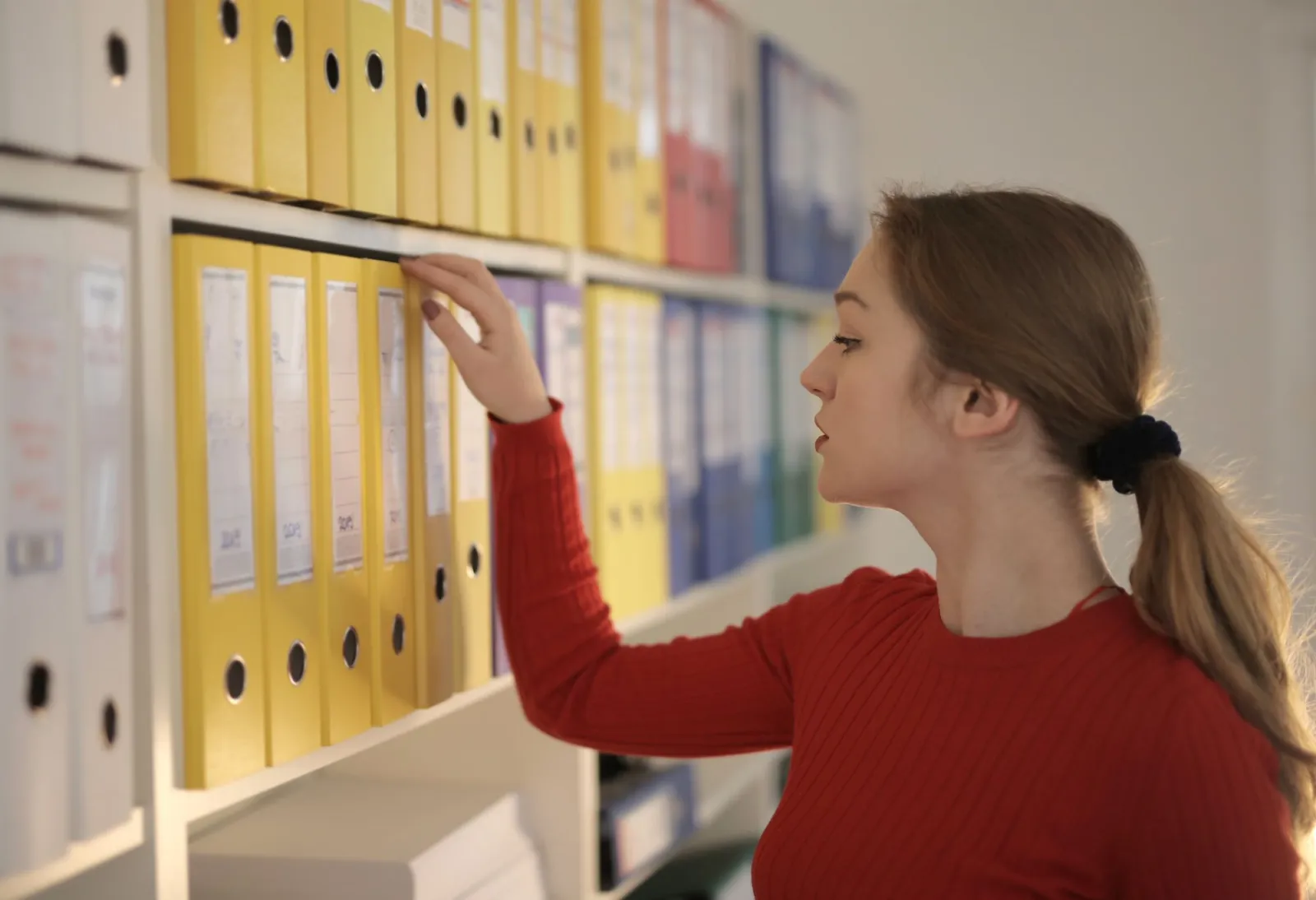 Organized folders on a desk, representing clean file management