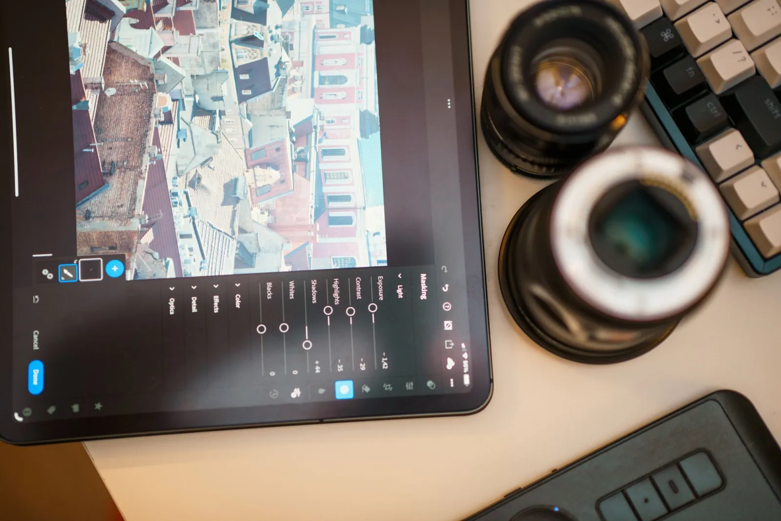 Photo editing workspace showing a laptop and editing tools
