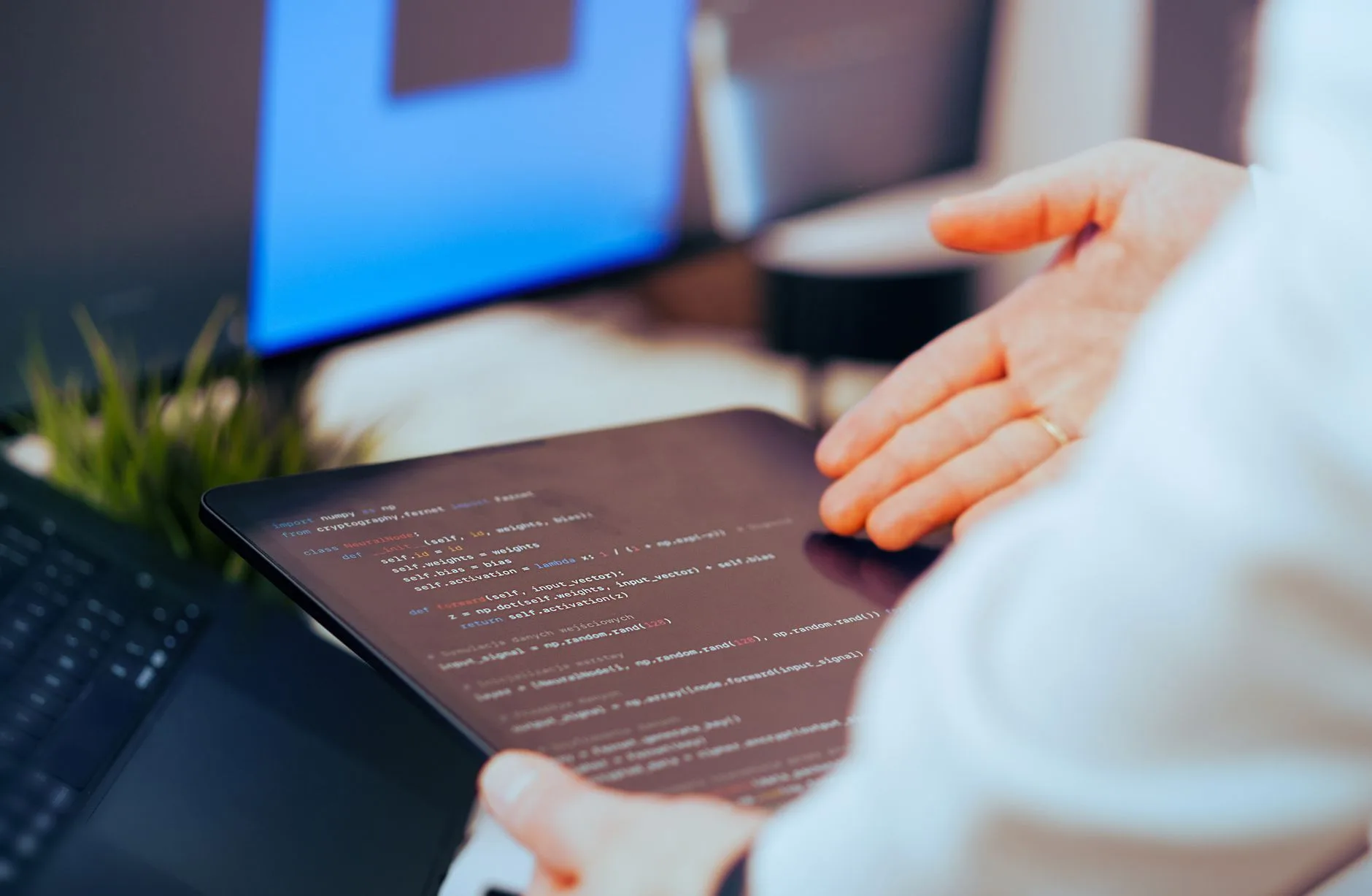A developer reviewing AI-generated code on a tablet before approving the agent's tool calls