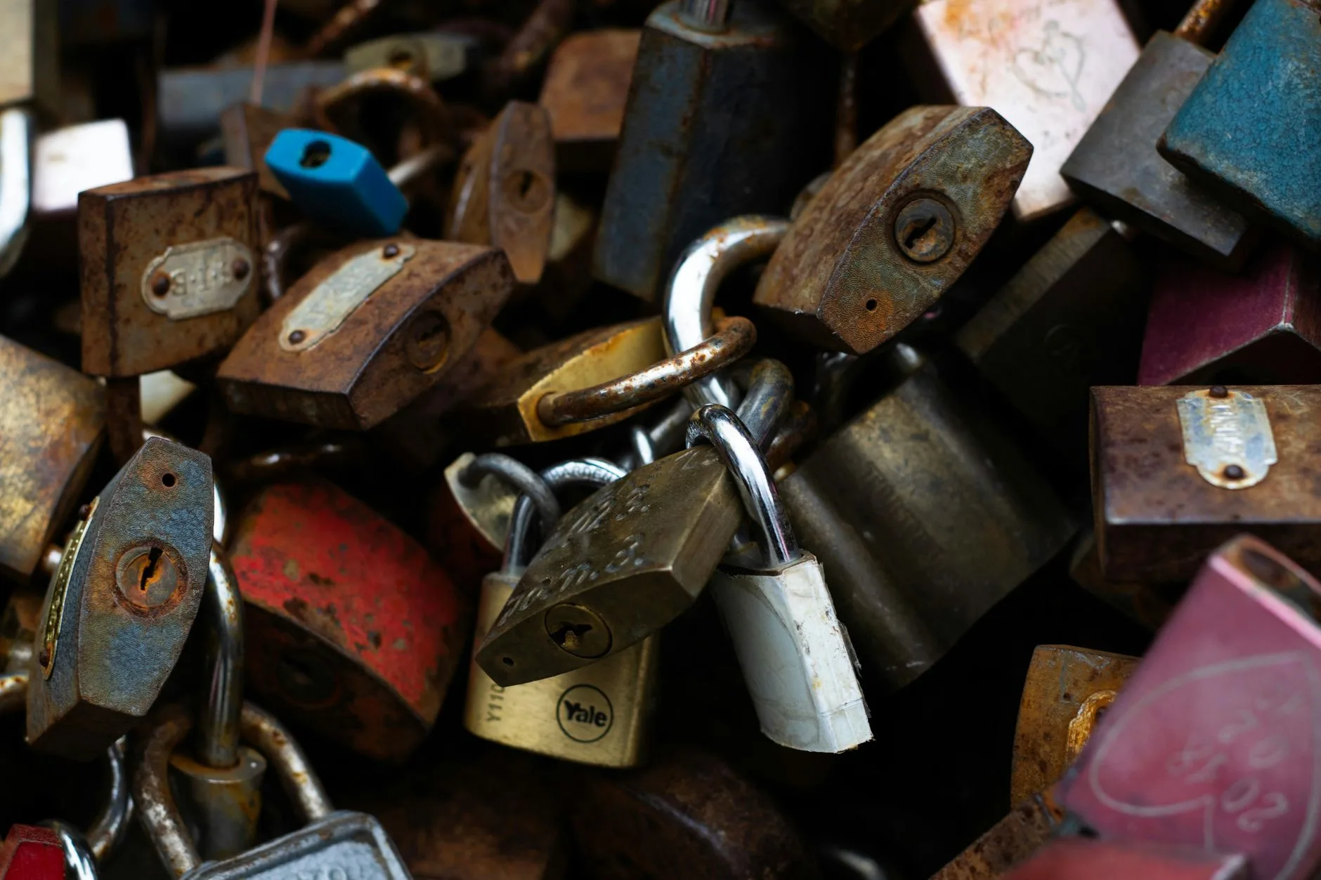 A pile of padlocks symbolizing rotating secrets and keeping API keys out of an AI agent's context