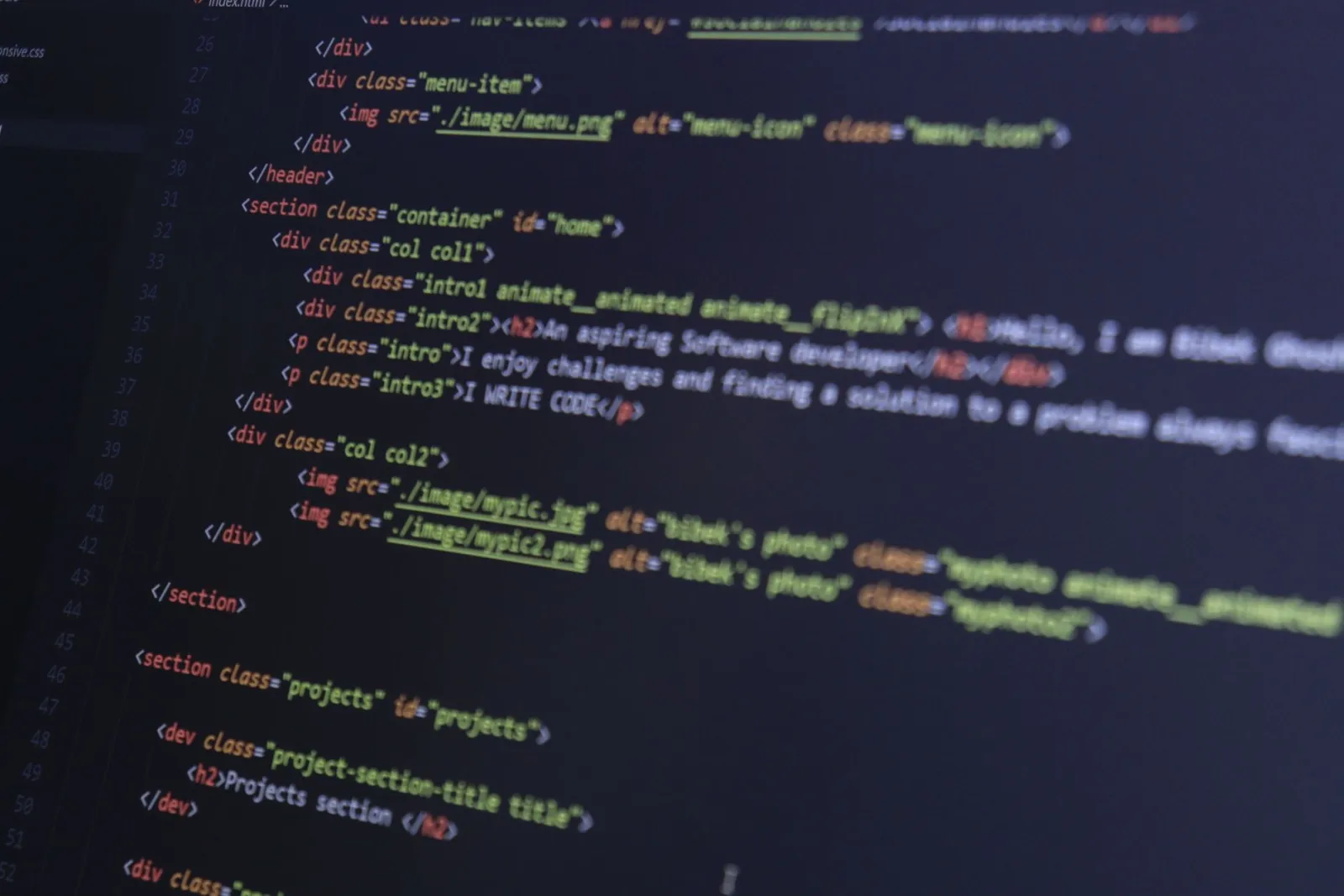 HTML and CSS code on a computer monitor, highlighting web development and programming.