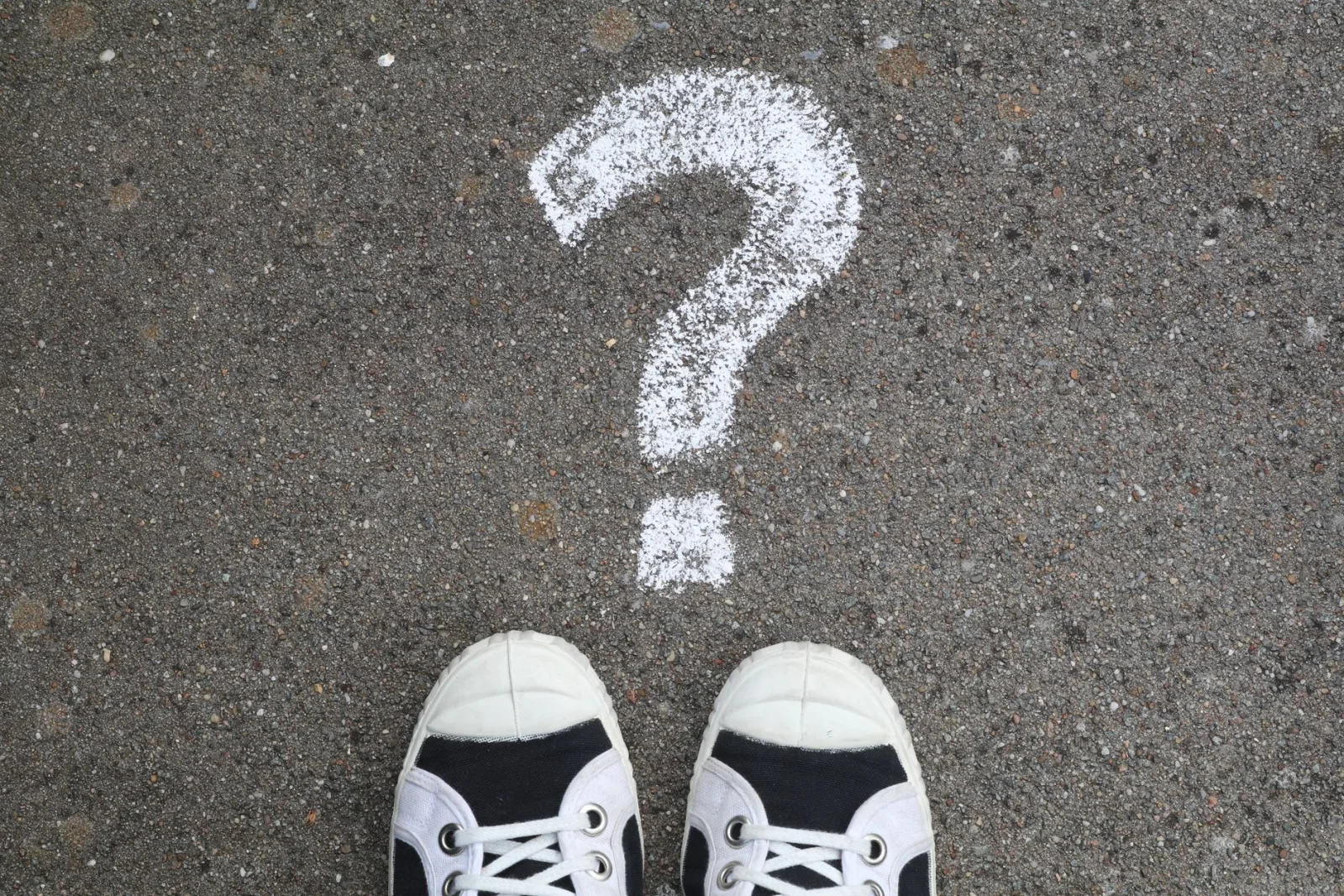 A chalk question mark on pavement, the kind of inquiry batch processing answers