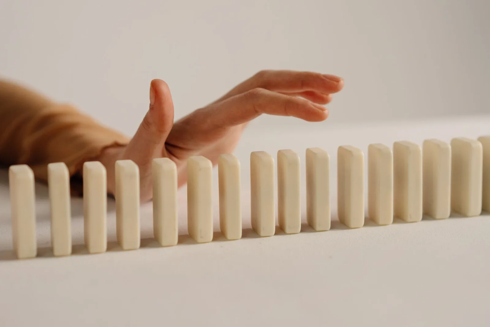 Dominoes mid-fall, capturing the kind of motion that frame timing controls in a GIF