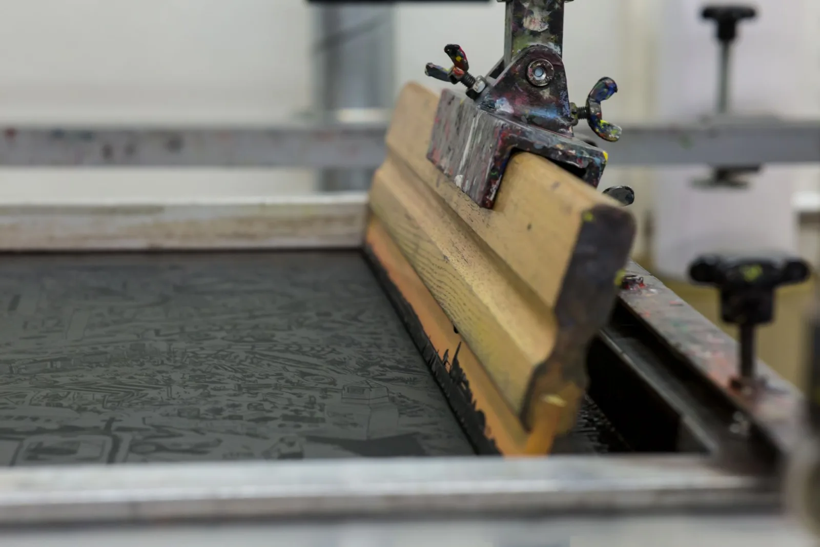 A screen printing setup showing ink colors that must match the source profile