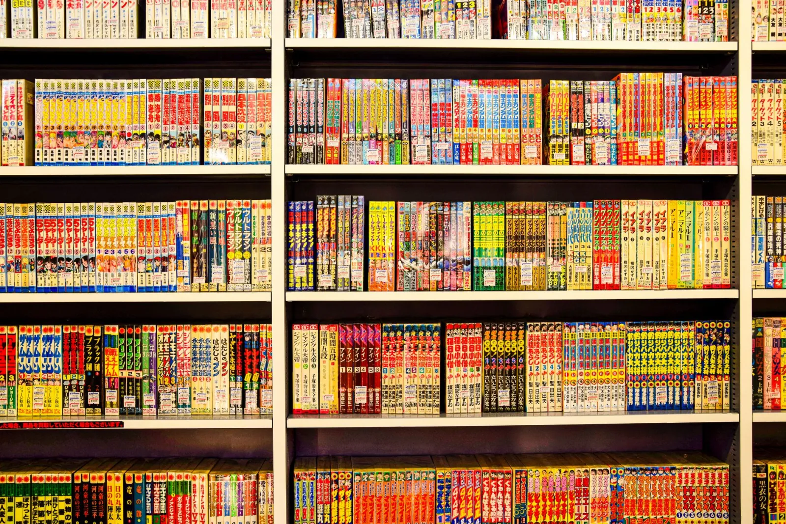 Shelves filled with colorful manga volumes showing dense comic color references