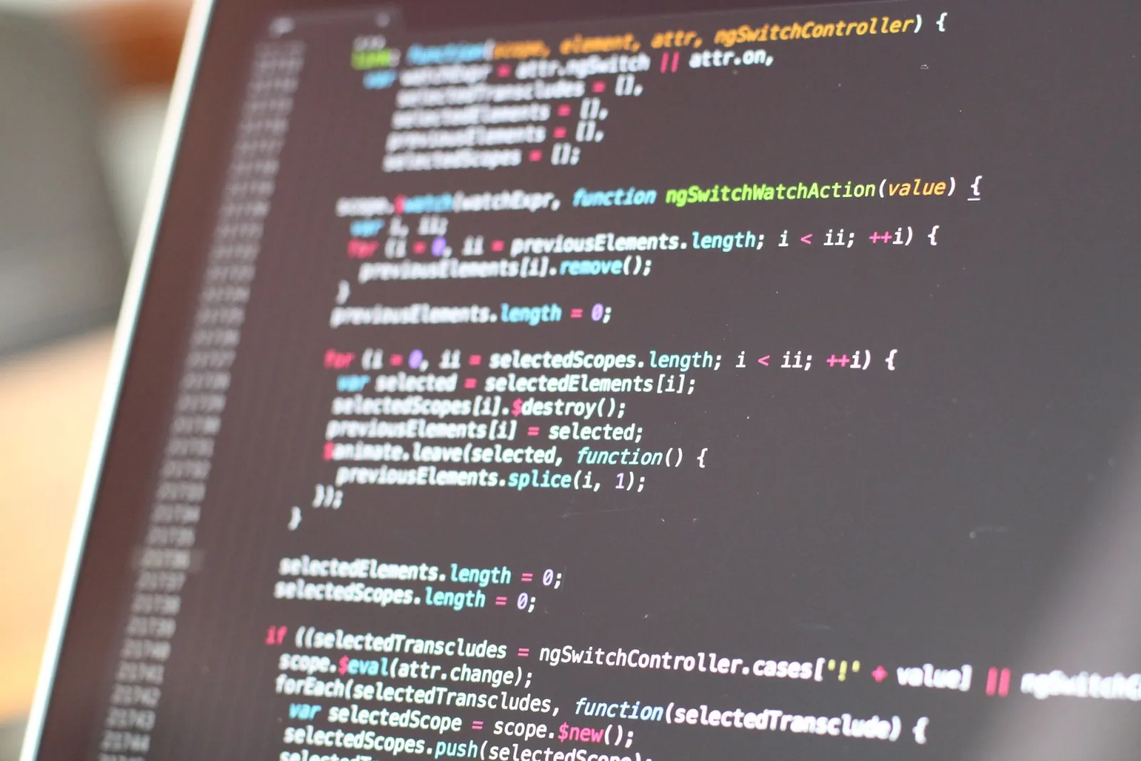 Close-up of colorful source code on a screen, the kind of high-frequency content where format choice is most visible