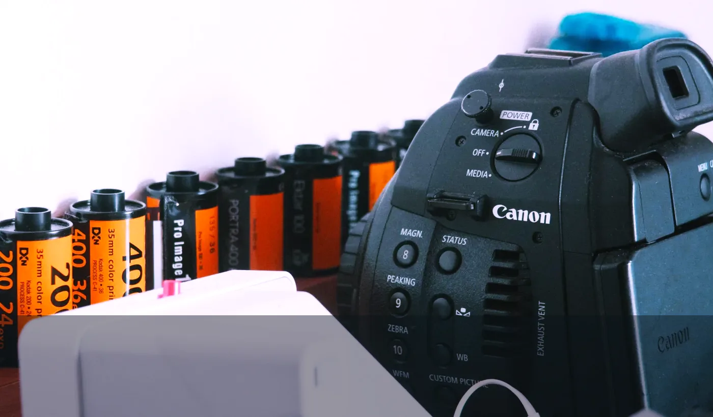 Film camera and color rolls with a cross process note about E-6 and C-41 chemistry