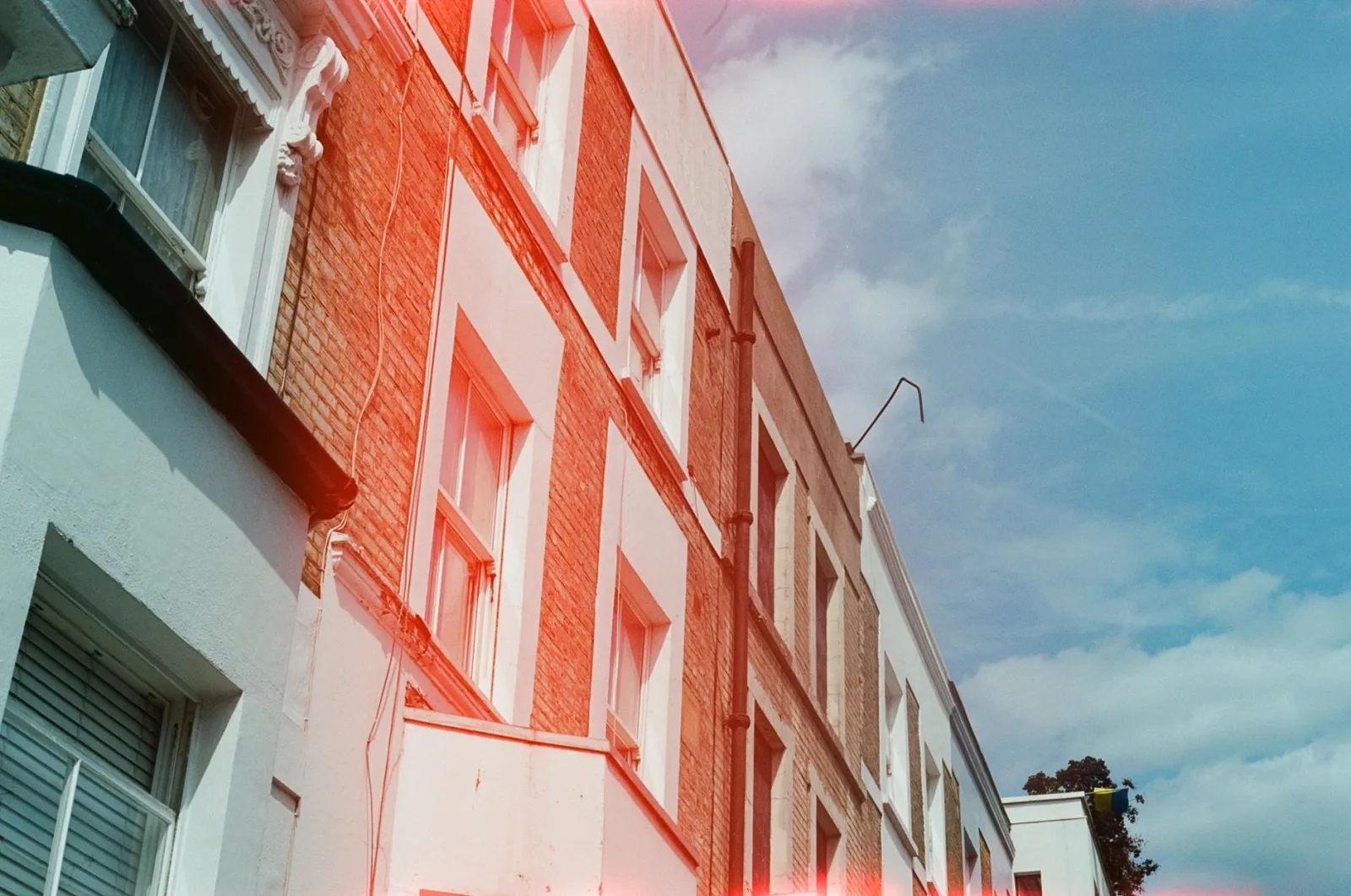 Urban buildings with strong light, where the leak effect's blend mode matters