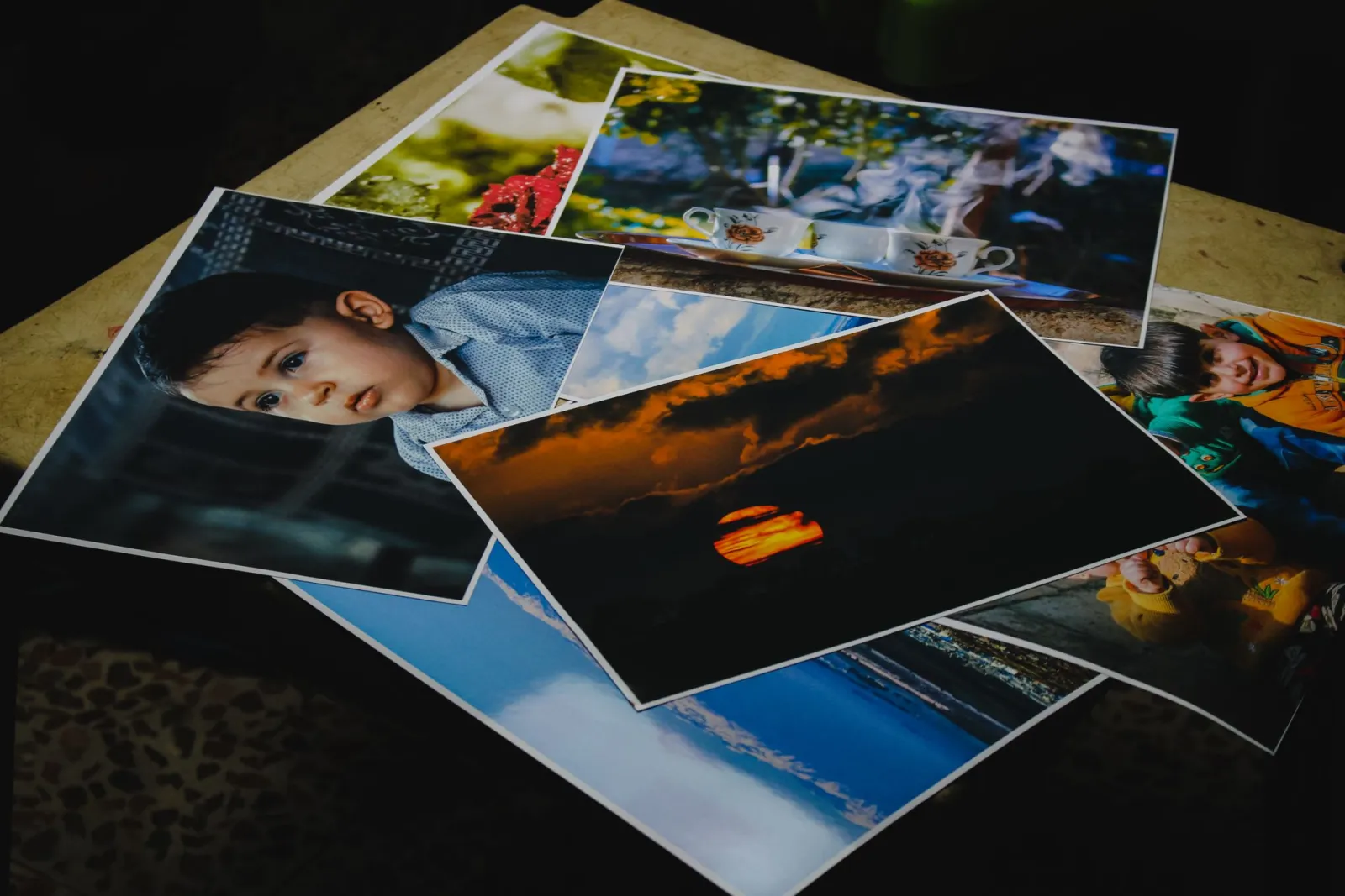 Collection of printed photographs of varied subjects, the output where DPI finally becomes real