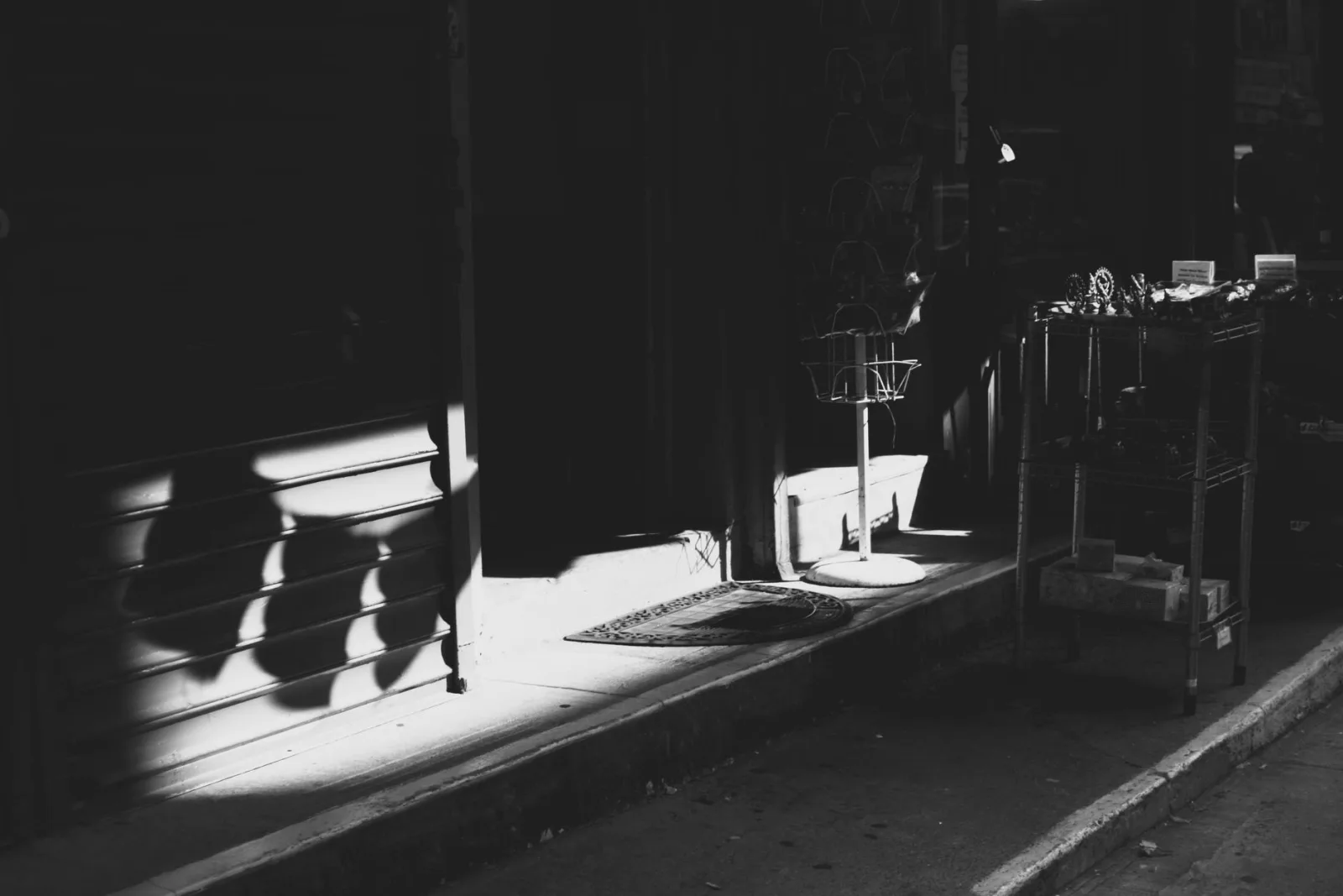 Moody shadow play on a sidewalk, the natural shadows a generator emulates