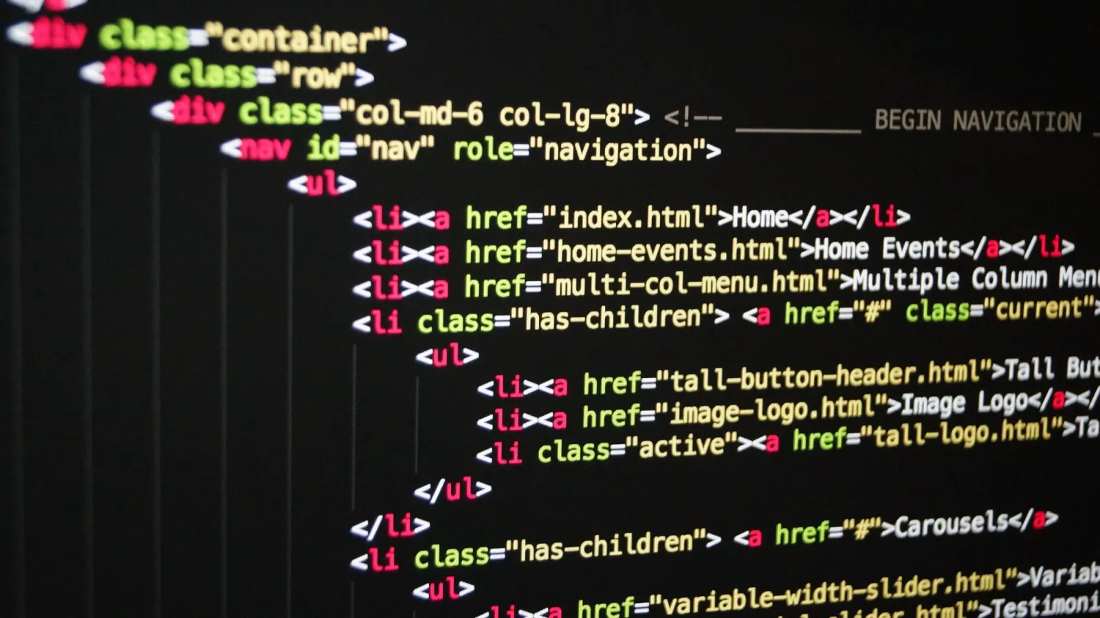 HTML code on a computer screen, the markup an image size reducer outputs as picture and source tags for WebP