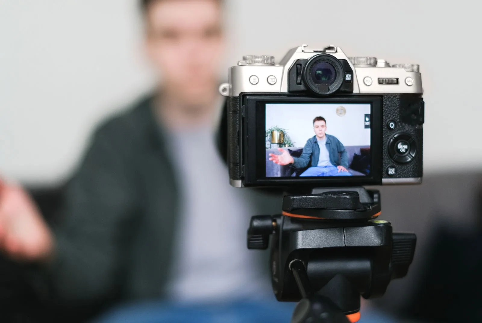 Mirrorless camera on a tripod filming a creator, the kind of shoot Kling images can stand in for