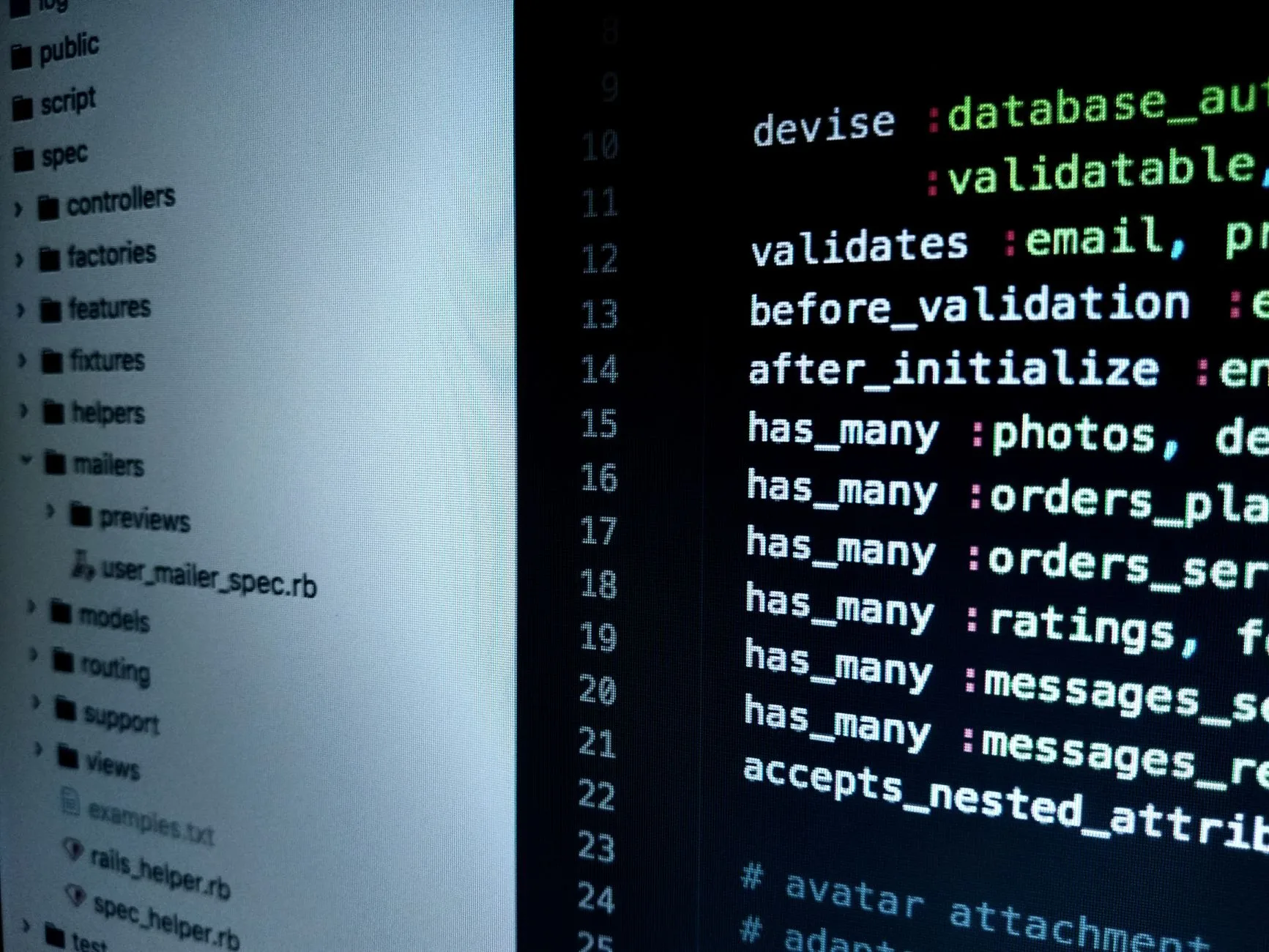Detailed view of source code on a computer monitor highlighting software development