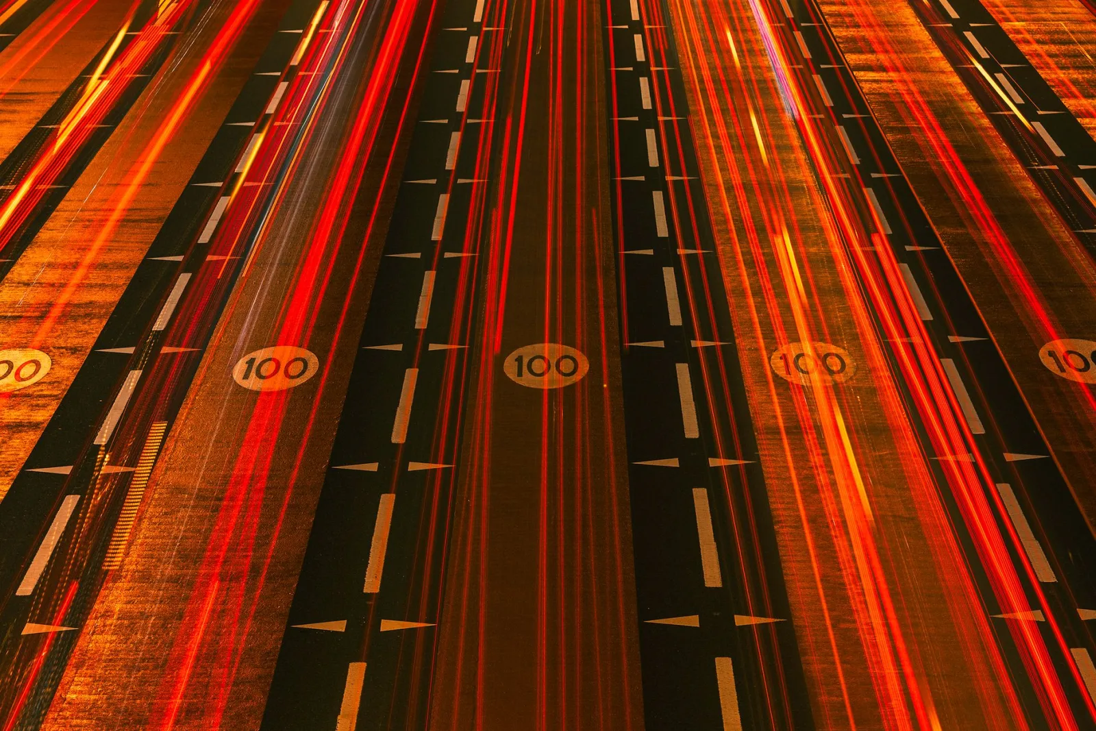 A night expressway with light trails, the speed optimization aims to deliver