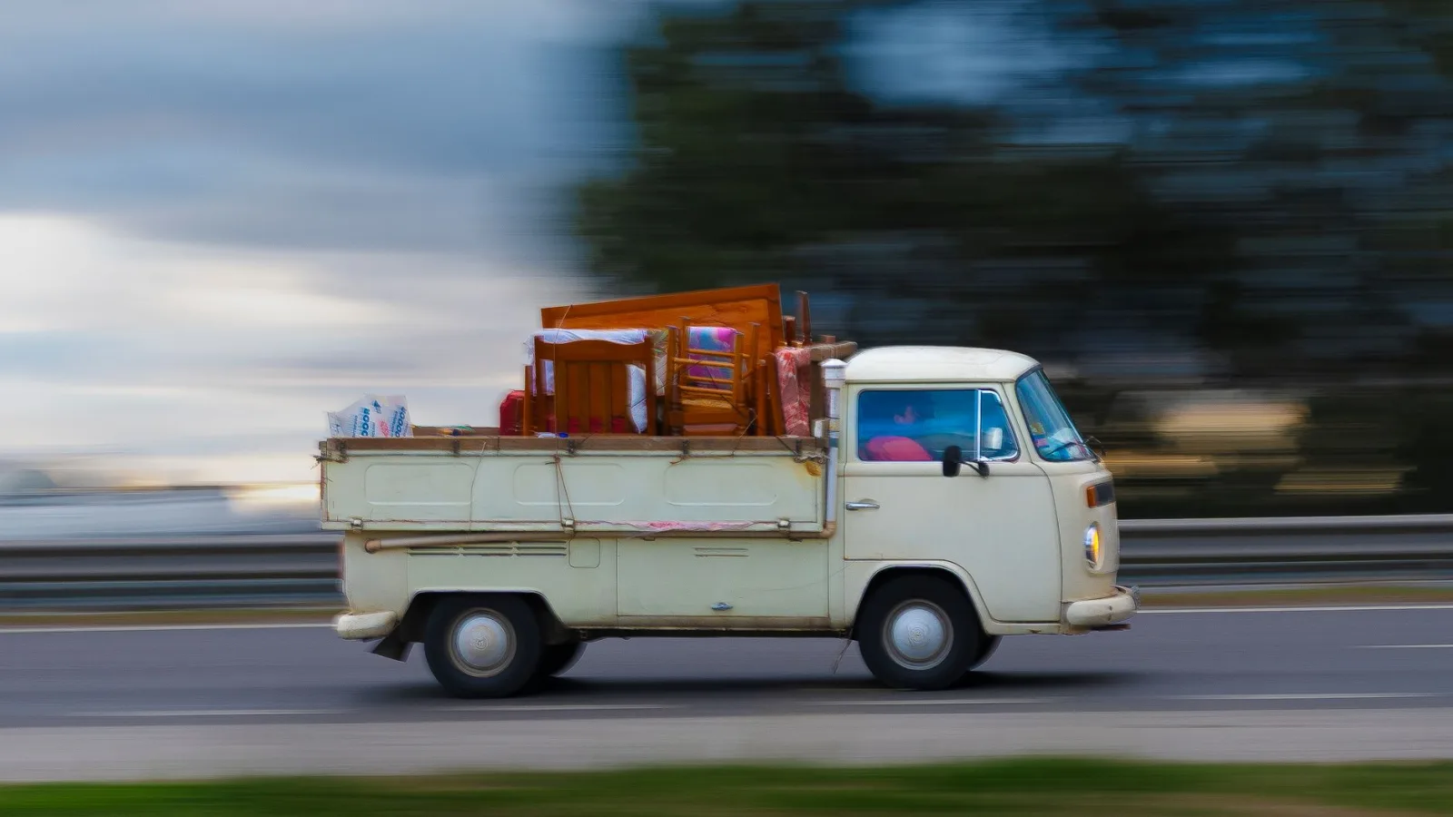 A vintage van speeding down a road, the fast delivery optimization enables