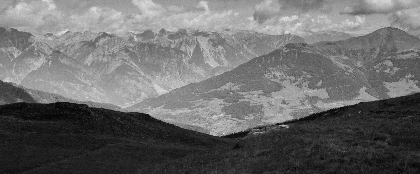 A black-and-white mountain range, where projection choice affects how the peaks bend