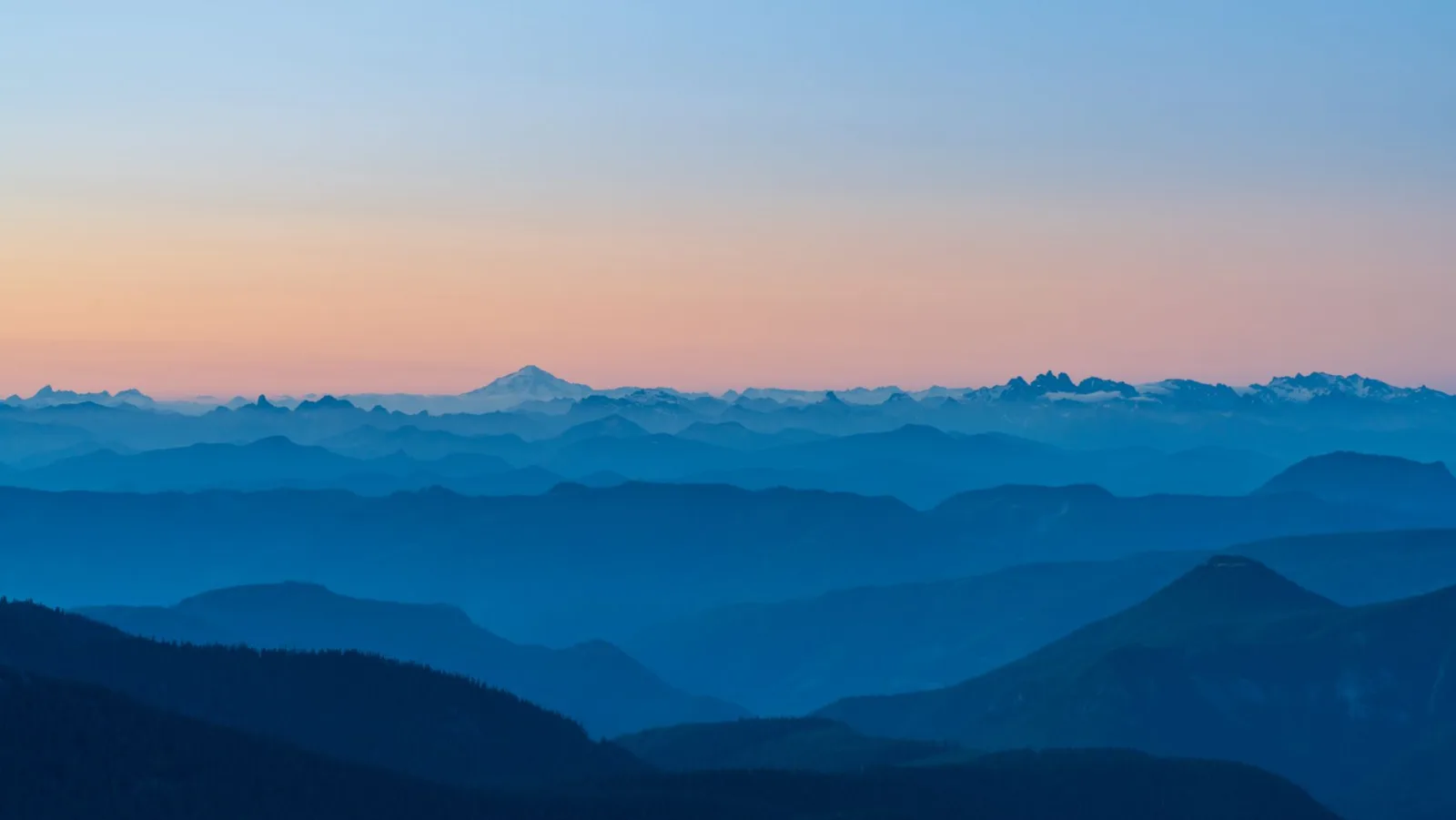 A tranquil mountain landscape at dusk, where careful alignment prevents visible seams between frames