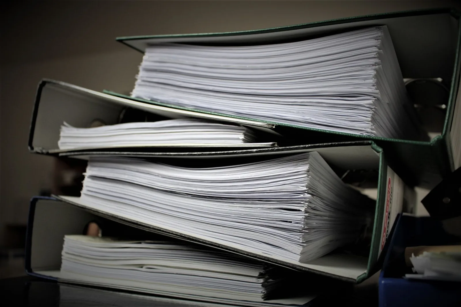 Binders full of documents, showing how print color must match expectations