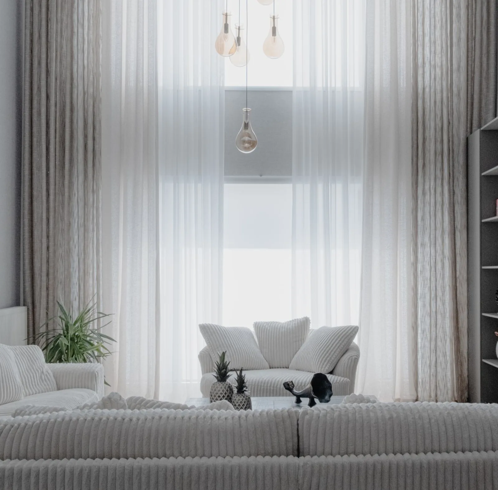 A bright minimalist living room where window and interior exposure are balanced