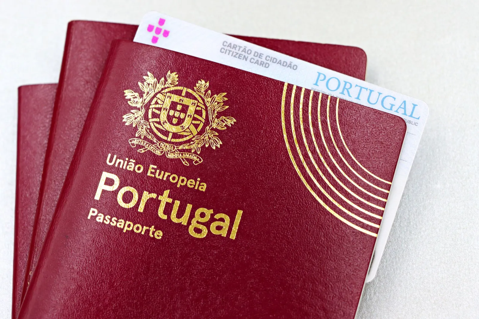 Close-up of a passport book and ID citizen card on a surface