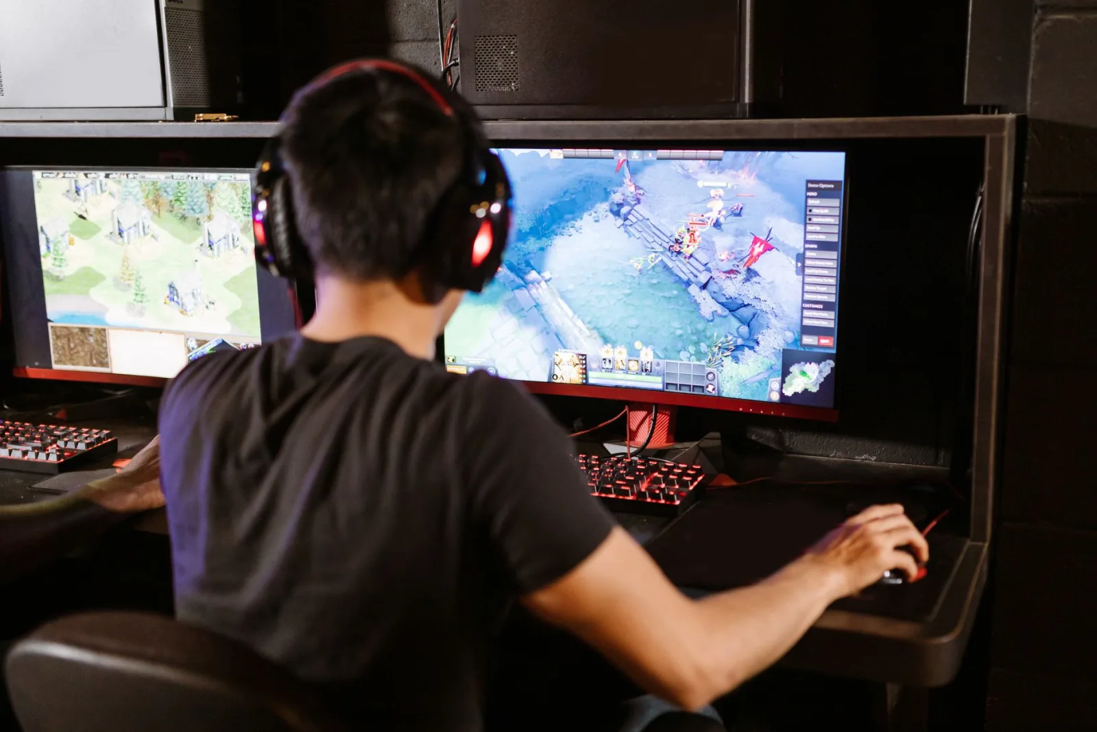 A gamer on dual monitors, the kind of high-DPI setup srcset targets