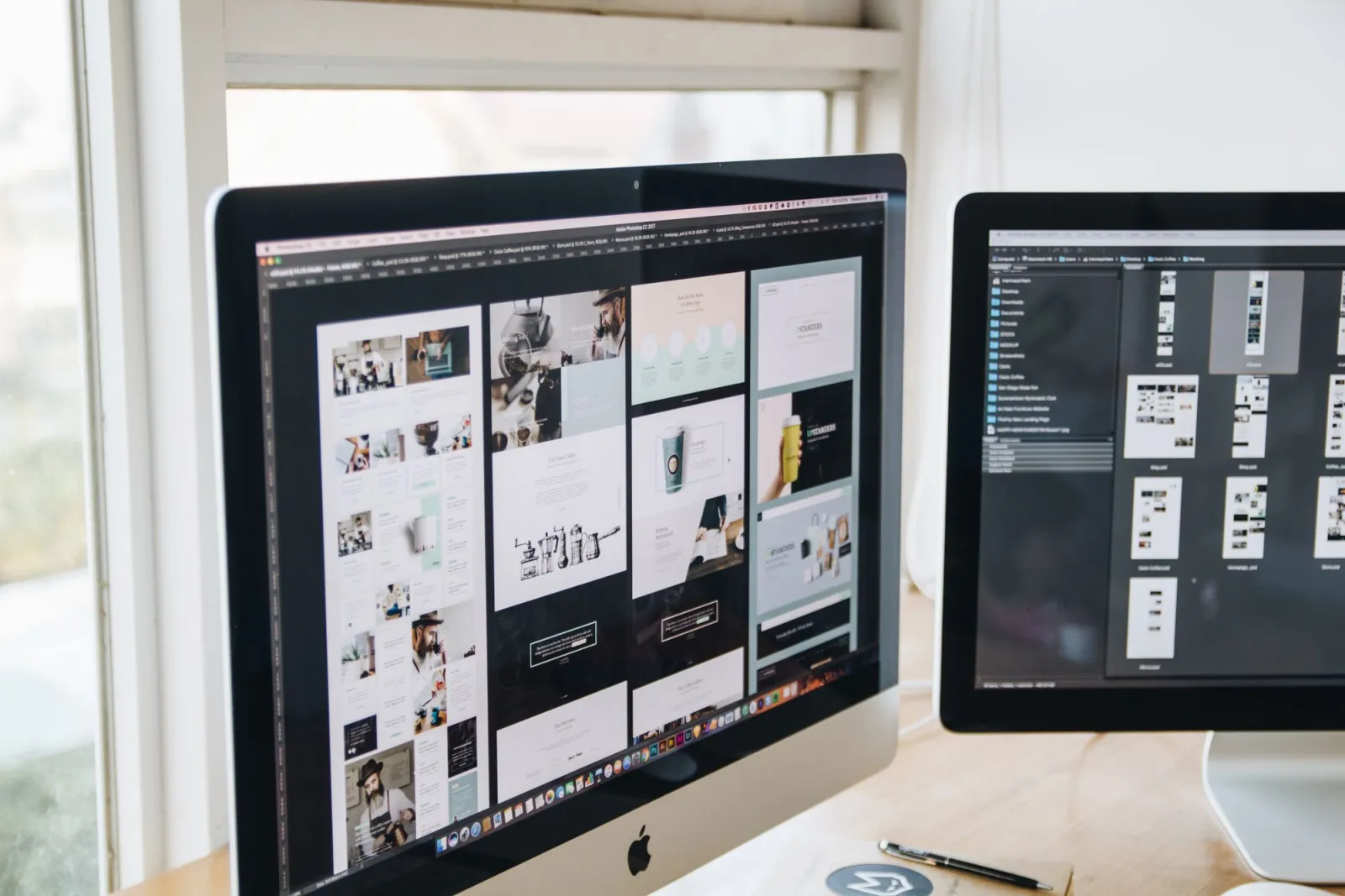 Modern designer dual-monitor workstation displaying creative software on both screens